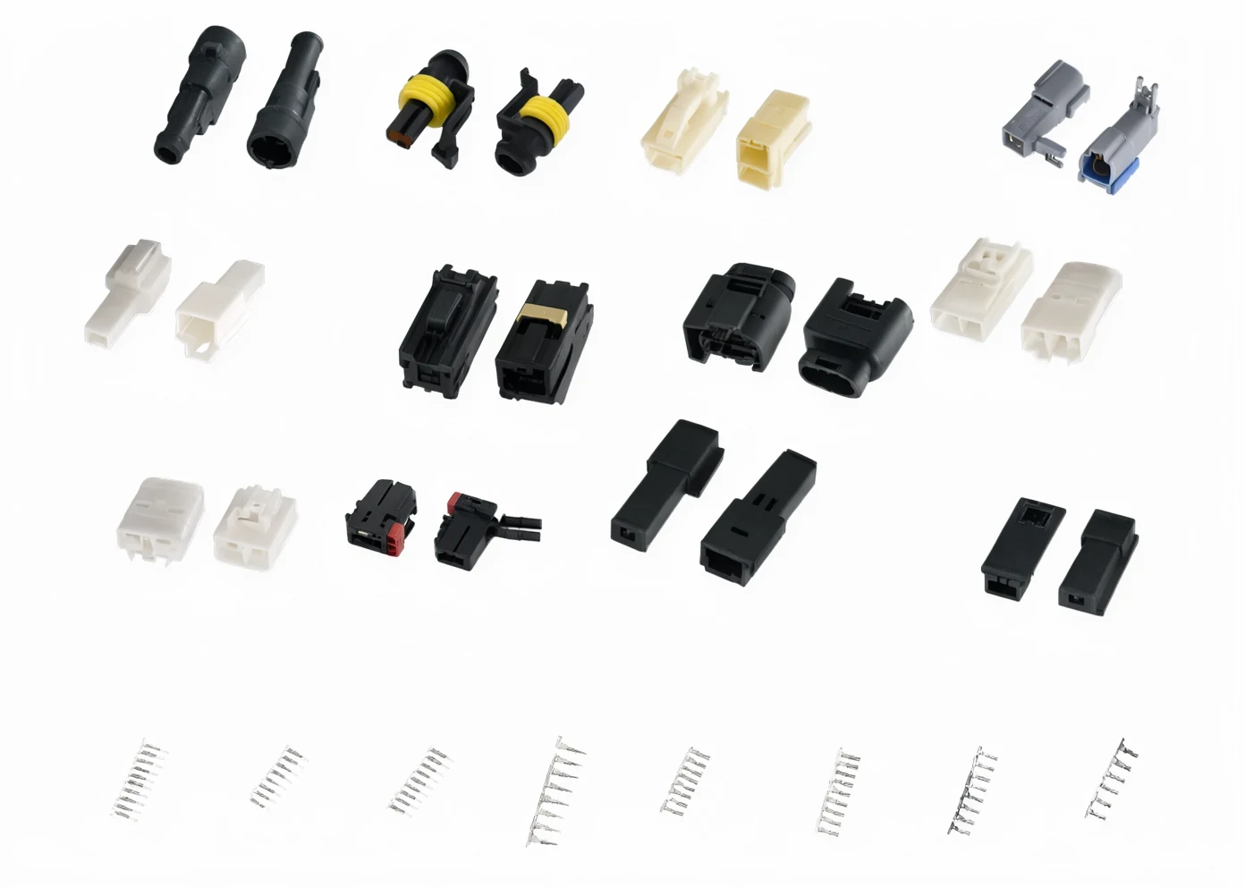 HEH automotive connector housings and a row of crimp terminal strips on a table